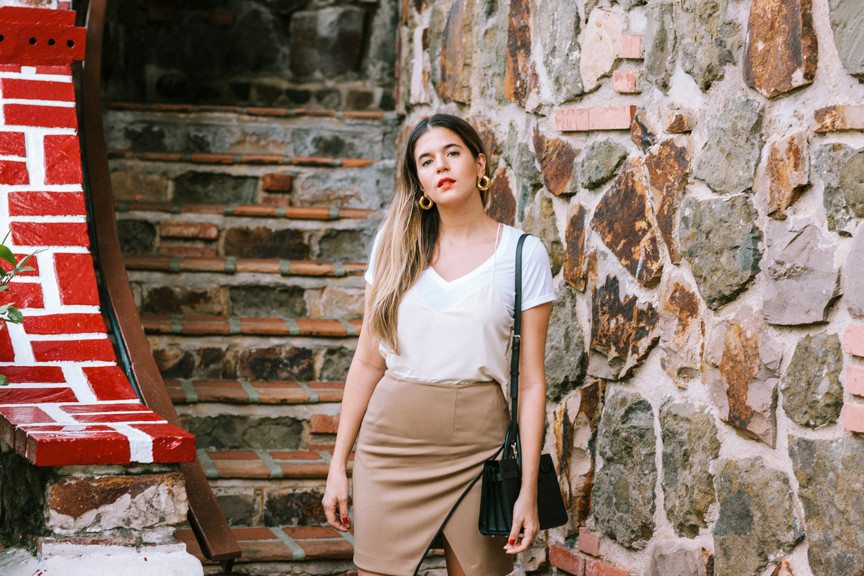 Maristella wearing a silk cami over a simple v-neck t-shirt and khaki skirt from Polo Ralph Lauren