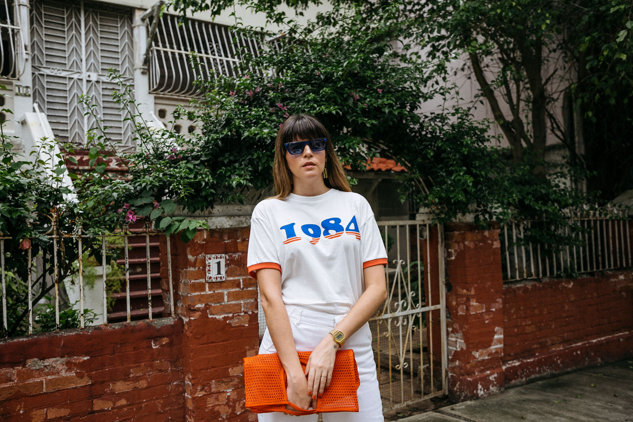 Maristella wears a 1984 t-shirt from Mango and Céline like blue sunglasses