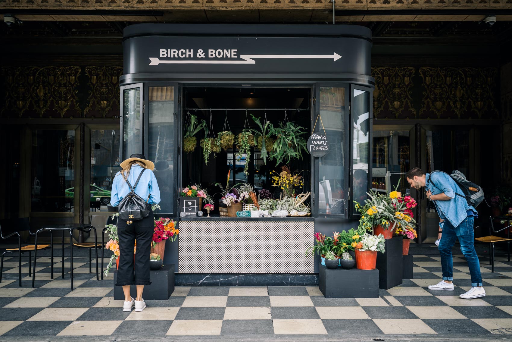 Maristella outside Birch & Bone flower shop kiosk at the Ace Hotel in Downtown Los Angeles wearing a vintage Chanel backpack