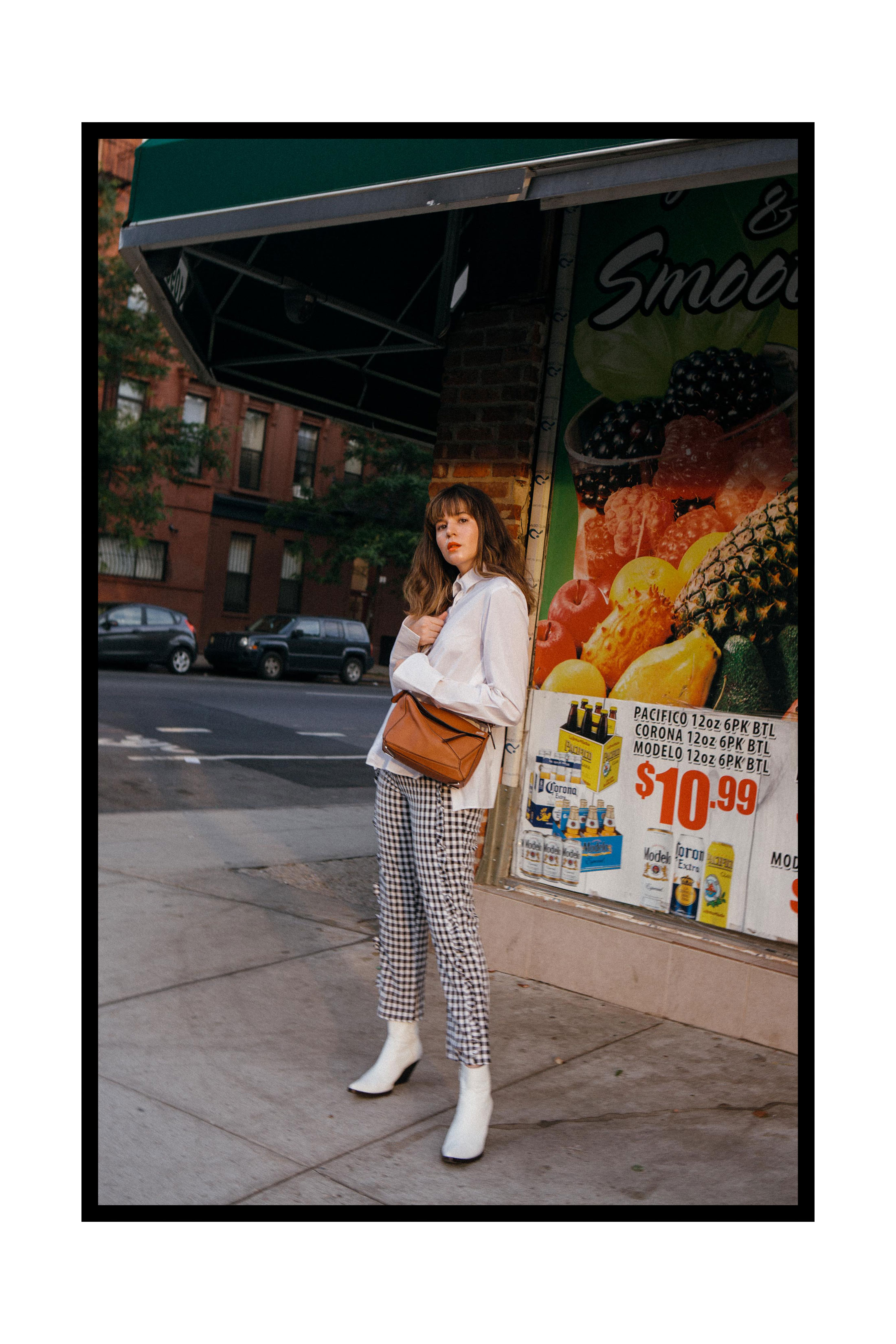 Maristella wears gingham tapered pants