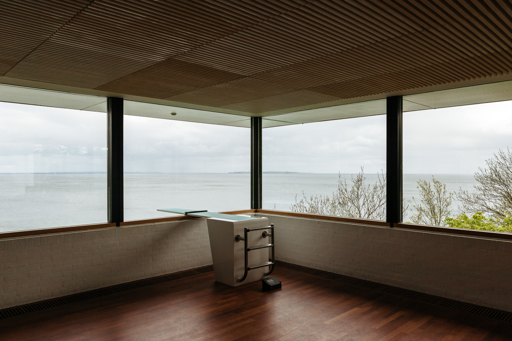 Louisiana Museum of Modern Art overlooking the water at the Øresund Strait in Denmark